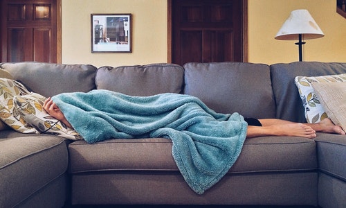 person sleeping on couch